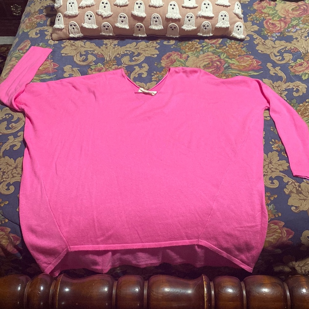 Bright pink ladies sweater.
